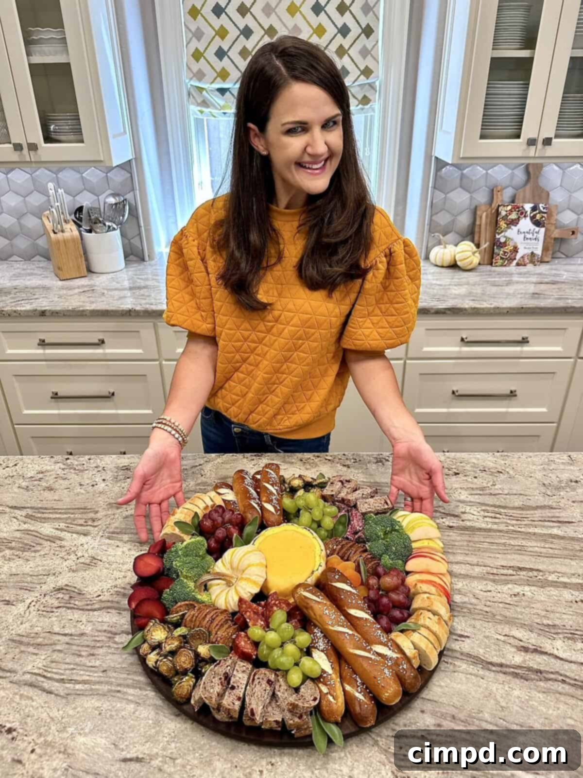 Guests enjoying the Fall Fondue Board, dipping various items into the melted cheese.