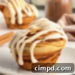 Spiced Pumpkin Cruffins 10 Beautifully glazed Pumpkin Spice Cruffins on a cooling rack, ready to be enjoyed as an autumnal treat.