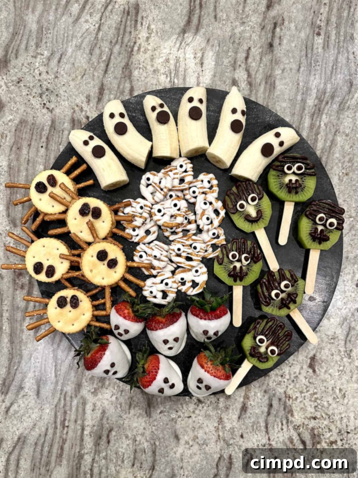 5 Spooktacularly Cute Halloween Goodies 2 Five delightful and easy-to-make Halloween treats, including Banana Ghosts, Strawberry Ghosts, Frankenstein Kiwi Pops, Peanut Butter Cracker Spiders, and Pretzel Mummies.
