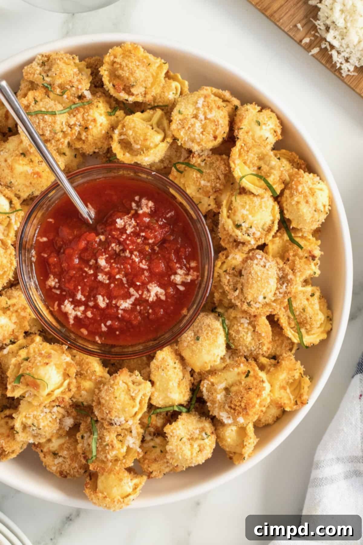 Crispy Toasted Tortellini Bites appetizer served with marinara