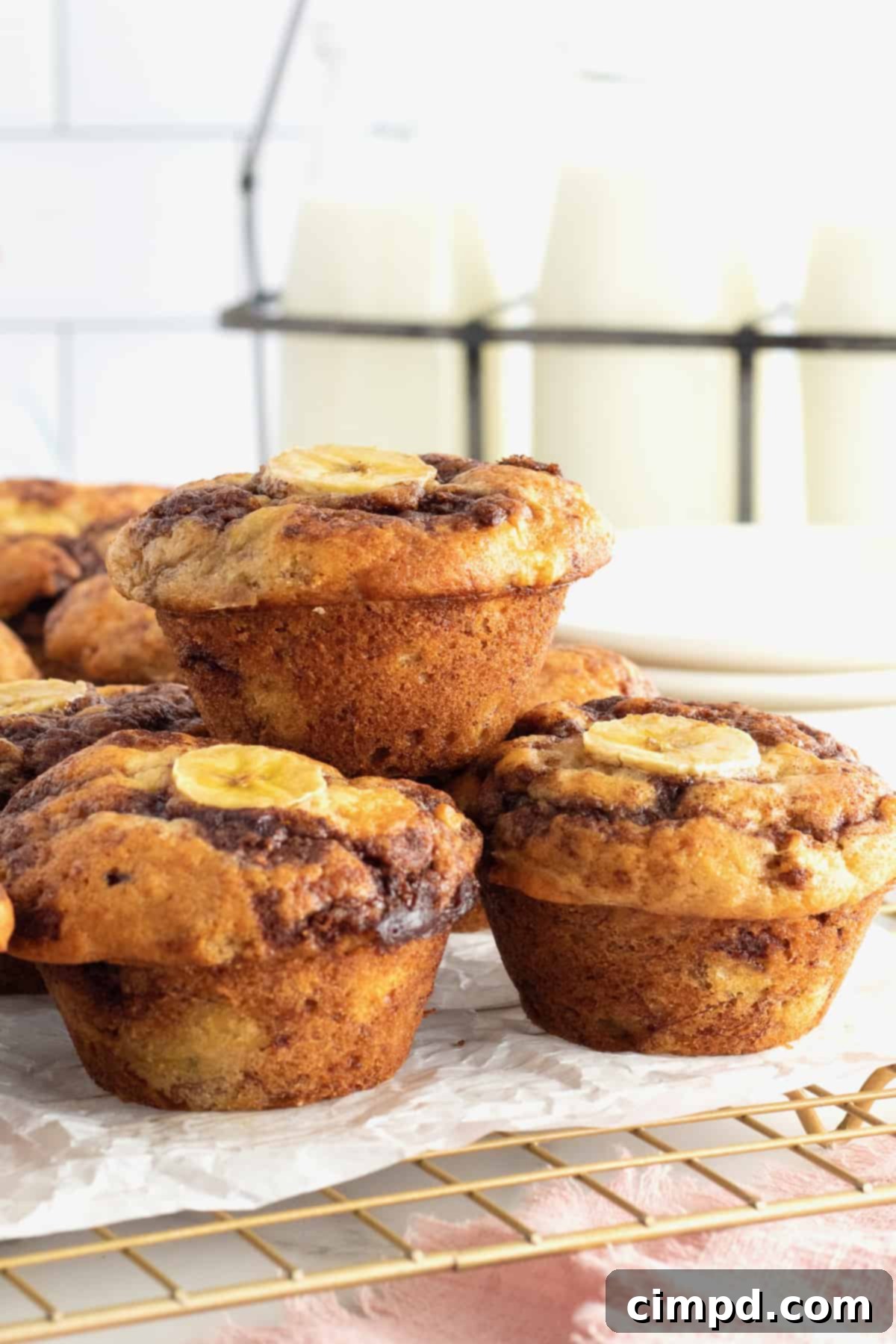 Cinnamon Swirled Banana Muffins on a platter, ready for storage