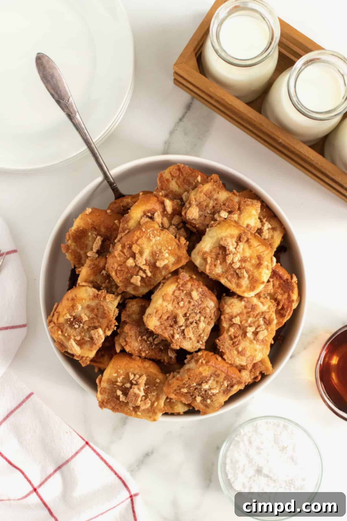 Cinnamon Toast Crunch French Toast Poppers 9 Cinnamon Toast Crunch French Toast Bites by The BakerMama