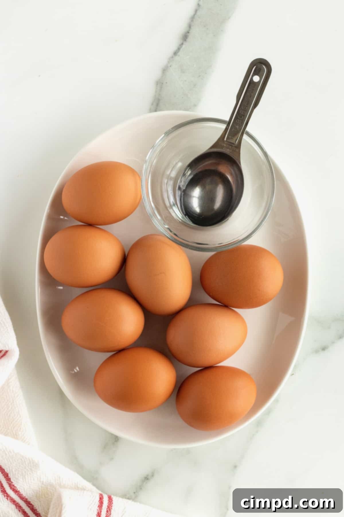 Ingredients needed for cooking soft-boiled eggs, including cold eggs and vinegar