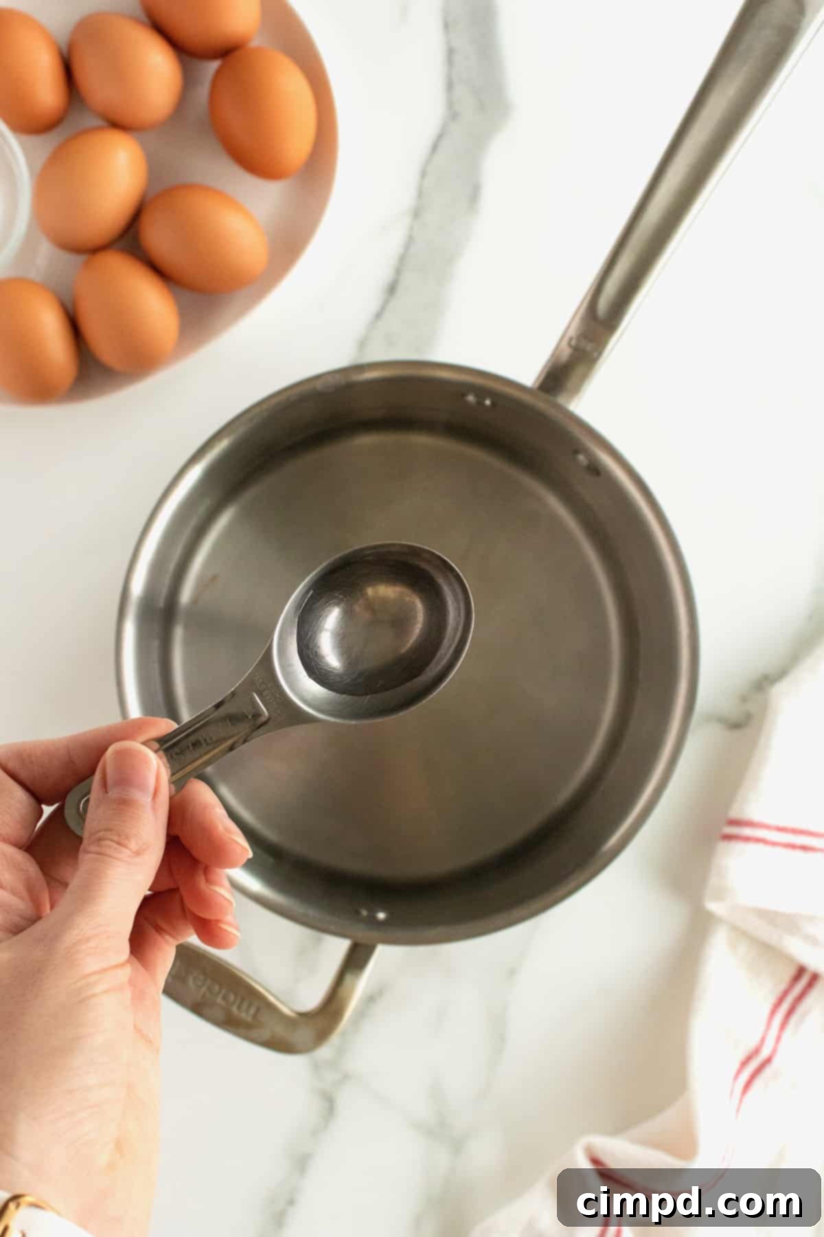 Boiling water in a pot for cooking soft-boiled eggs