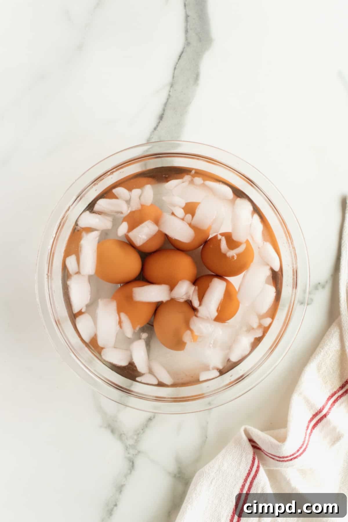 Soft-boiled eggs cooling in an ice bath