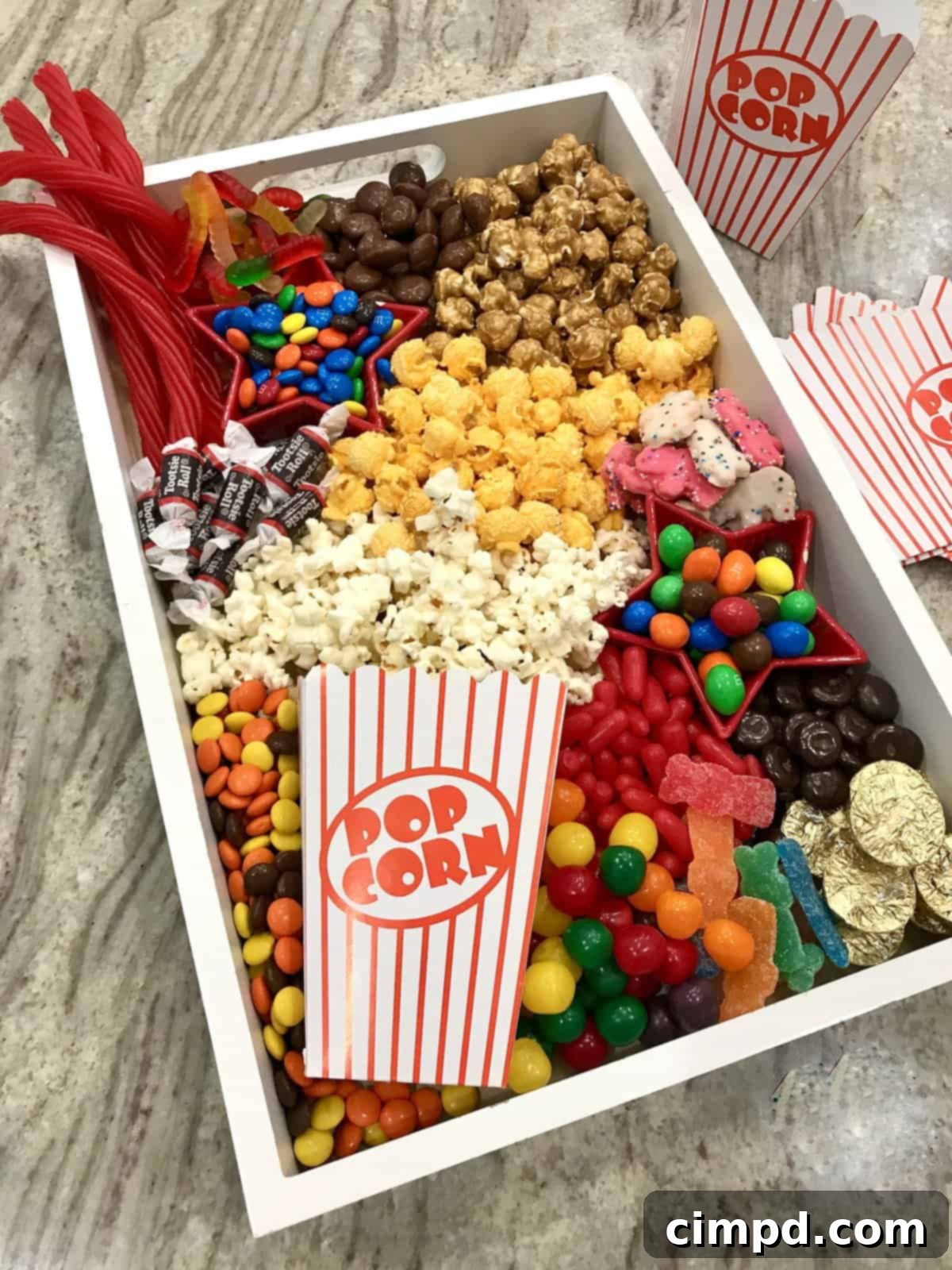 Ingredients laid out for a movie night popcorn board