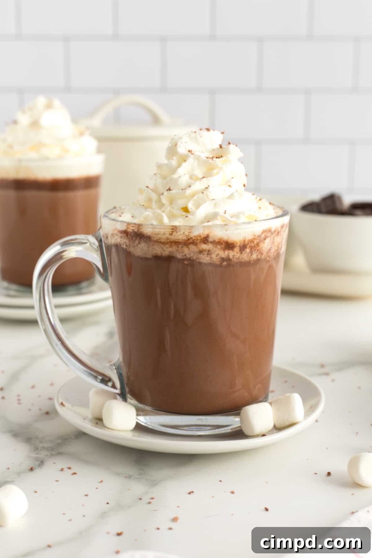 Rich Homemade Hot Chocolate served in a mug, topped with whipped cream and chocolate shavings, perfect for cozy moments.