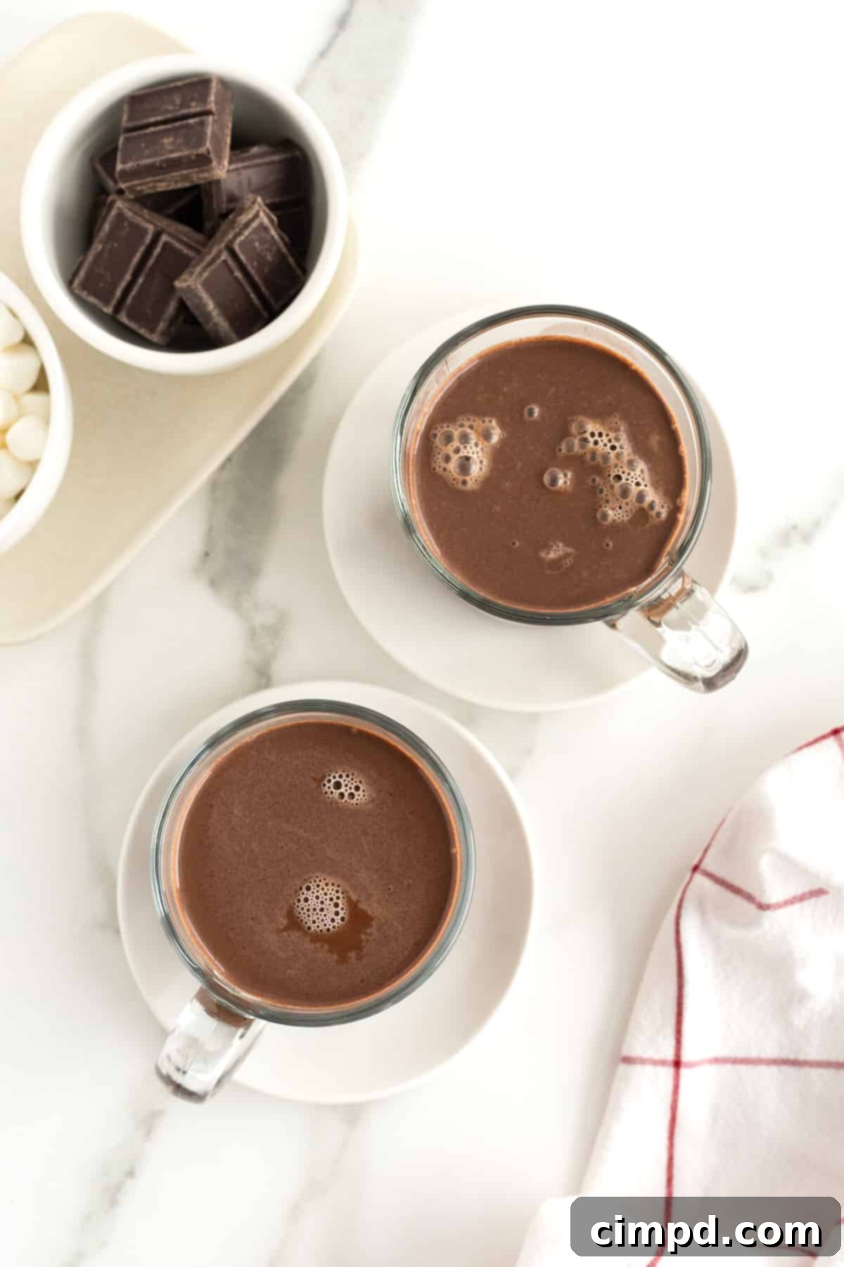 Freshly made Homemade Hot Chocolate in a rustic mug with a spoon, ready to be enjoyed.