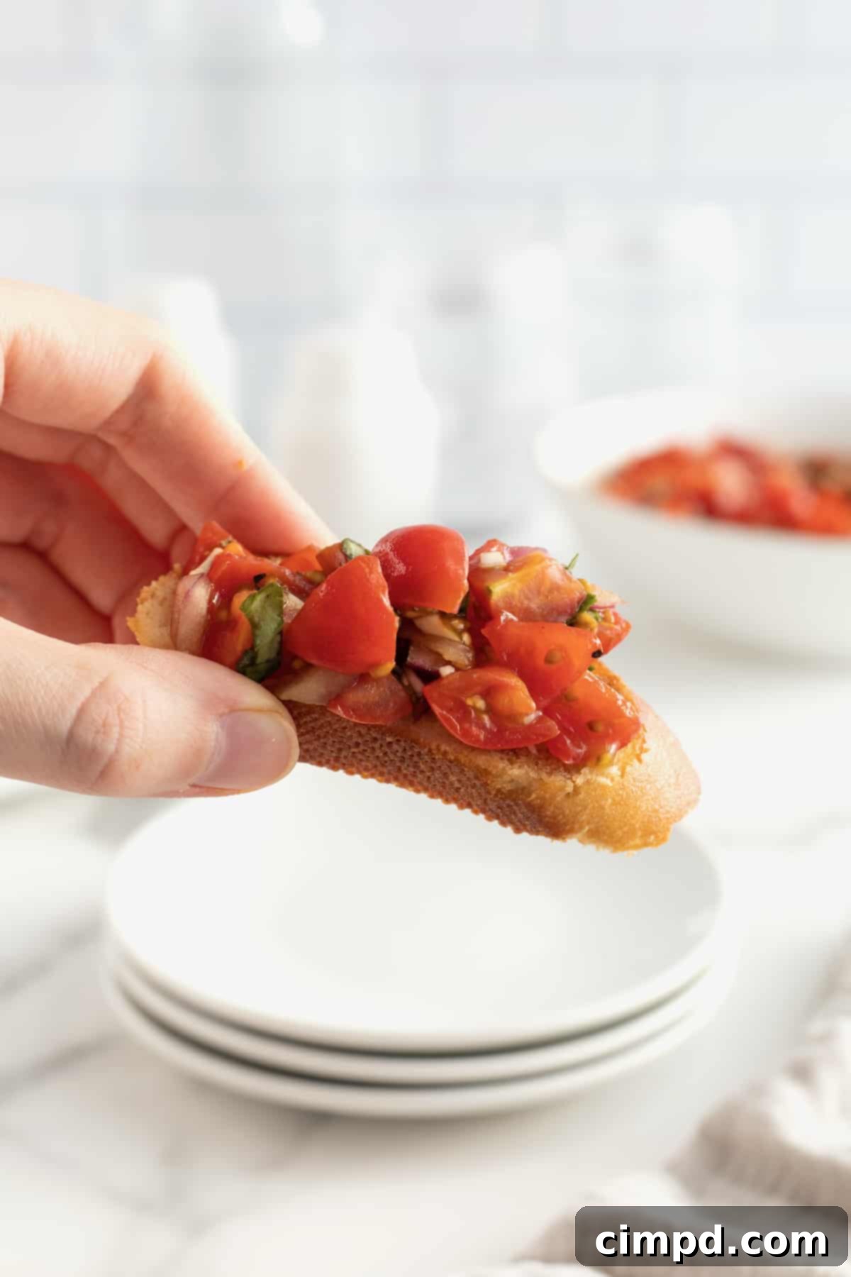 Classic Tomato Bruschetta beautifully arranged on a wooden board, perfect for a date night.