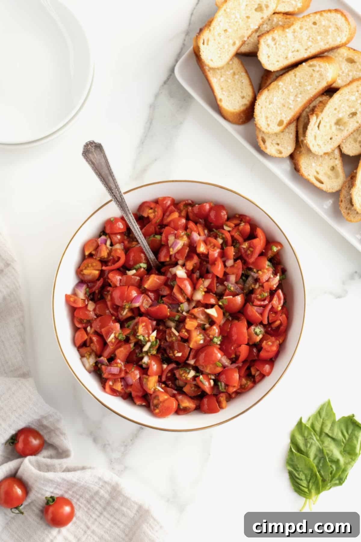 A platter of Classic Tomato Bruschetta, ready for serving at a party.