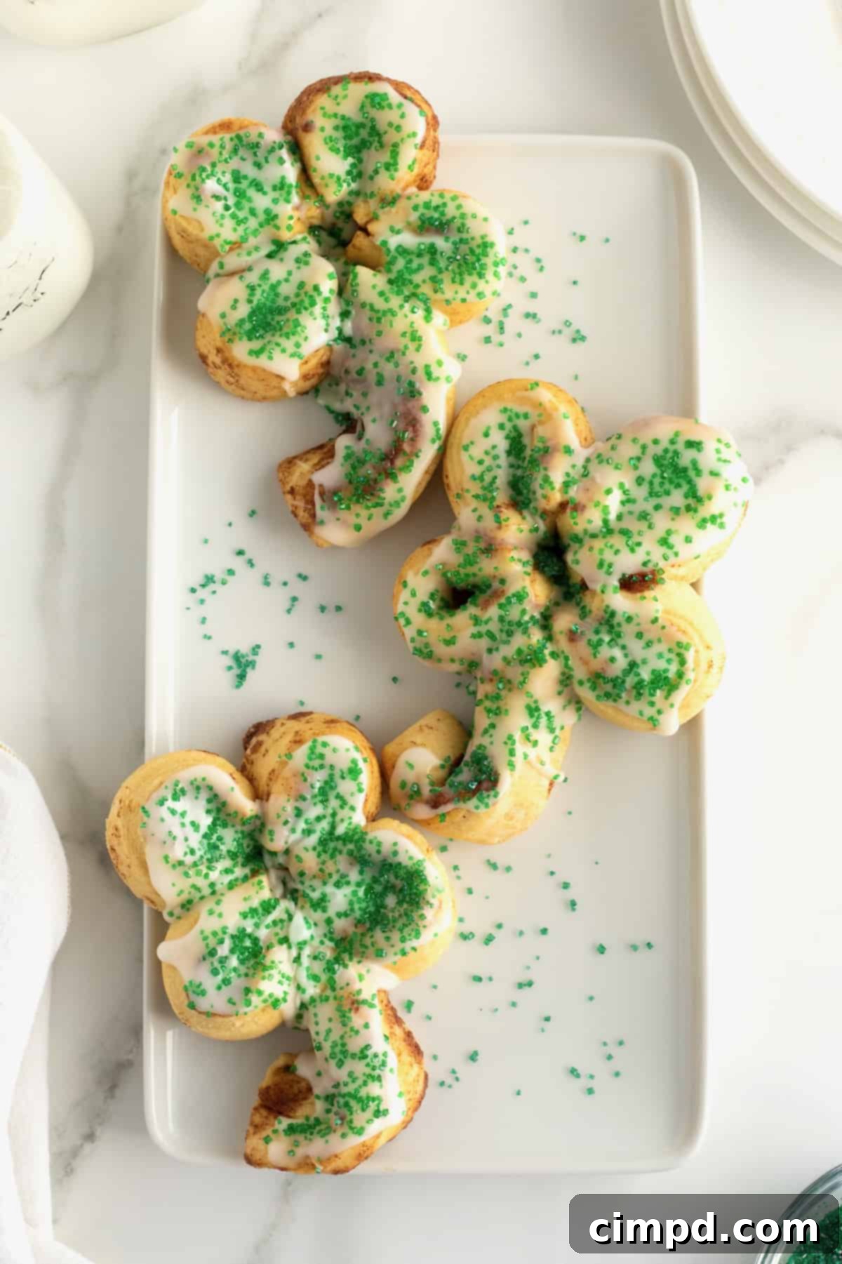 Festive St. Patrick's Day Cinnamon Rolls with vibrant green sprinkles