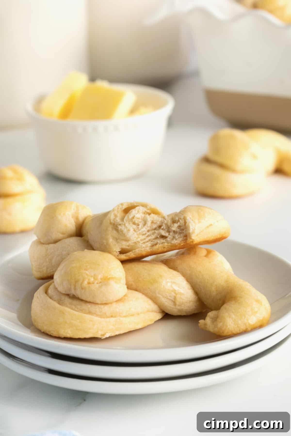 Fluffy Bunny Crescent Rolls 10 A close-up shot of a baked bunny shaped crescent dinner roll, showcasing its flaky texture and golden color, ready to be enjoyed