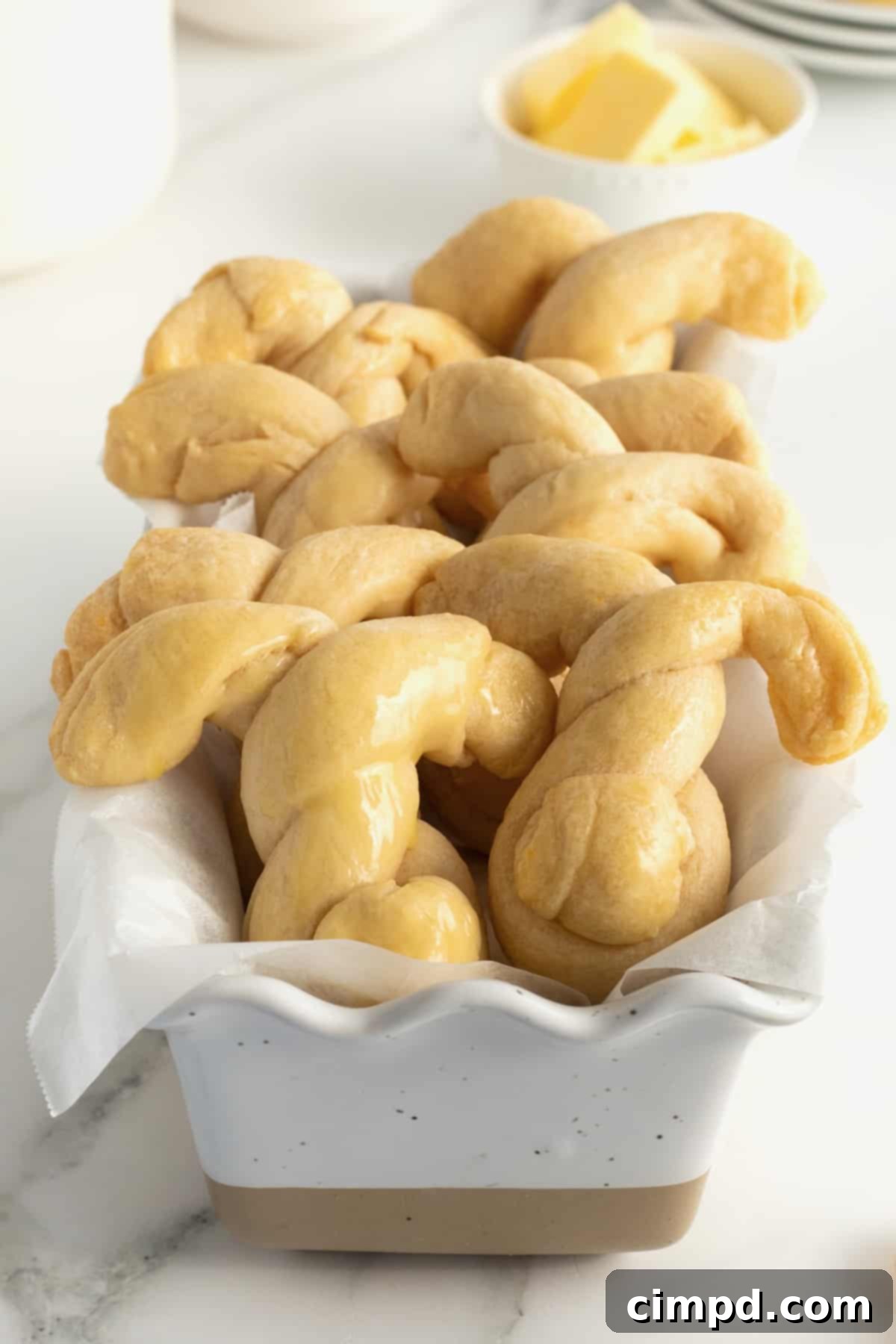 Fluffy Bunny Crescent Rolls 4 Several bunny shaped crescent dinner rolls served in a bread basket, perfect for an Easter gathering