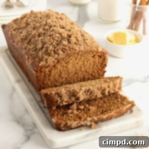 A square image of a baked Maple Cinnamon Streusel Bread with a generous streusel topping.
