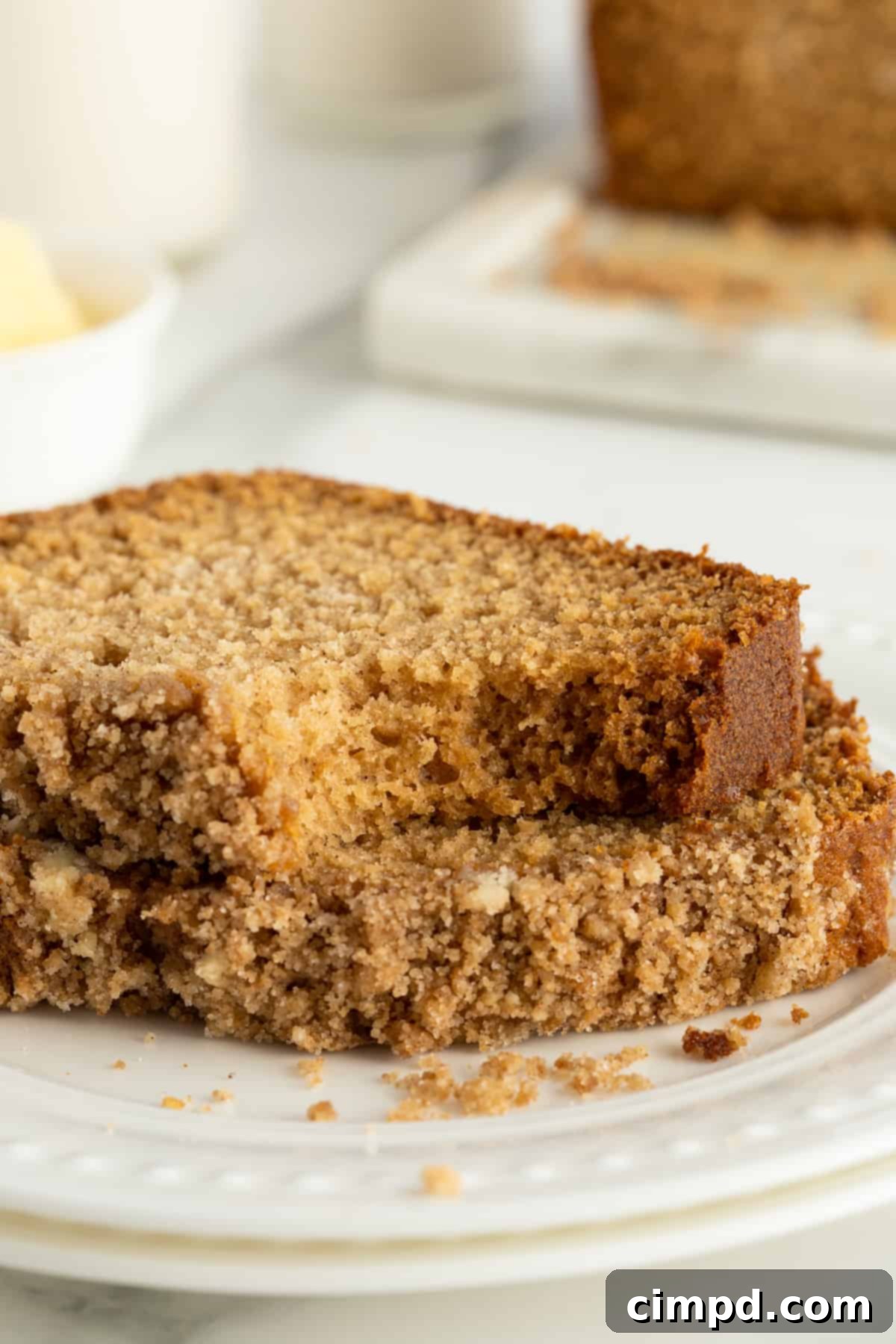 Maple Cinnamon Streusel Bread cooling on a wire rack, steam gently rising, with a rustic kitchen background.