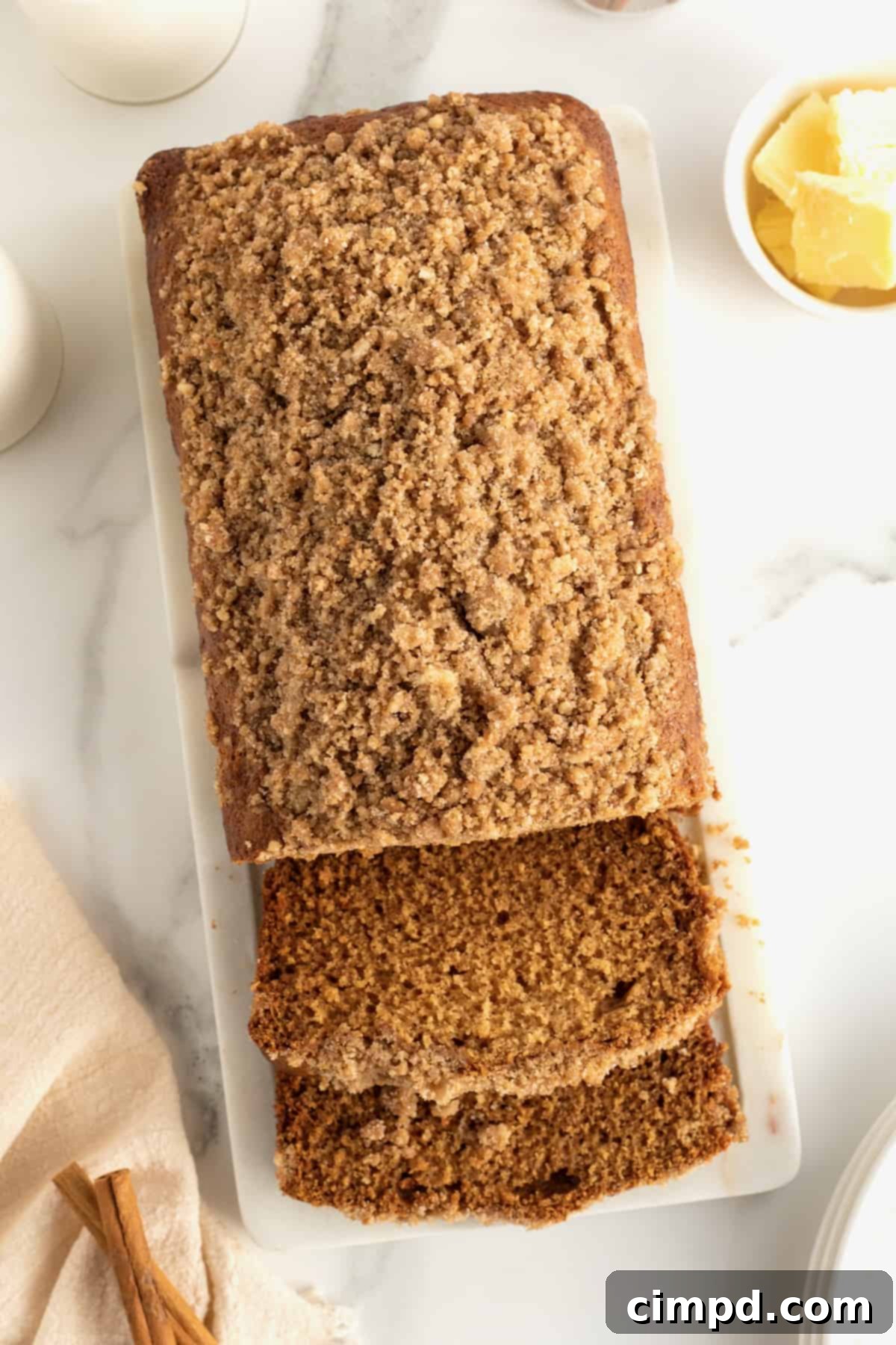 A serving platter with slices of Maple Cinnamon Streusel Bread, ready to be enjoyed.