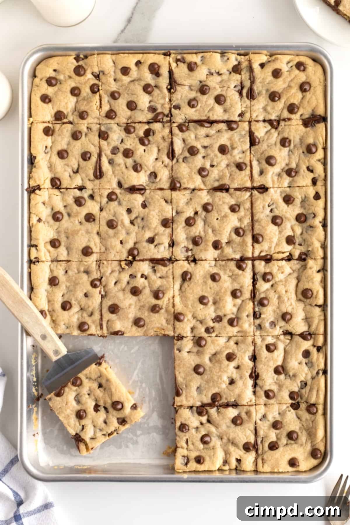 Sheet Pan Chocolate Chip Cookie Bars by The BakerMama