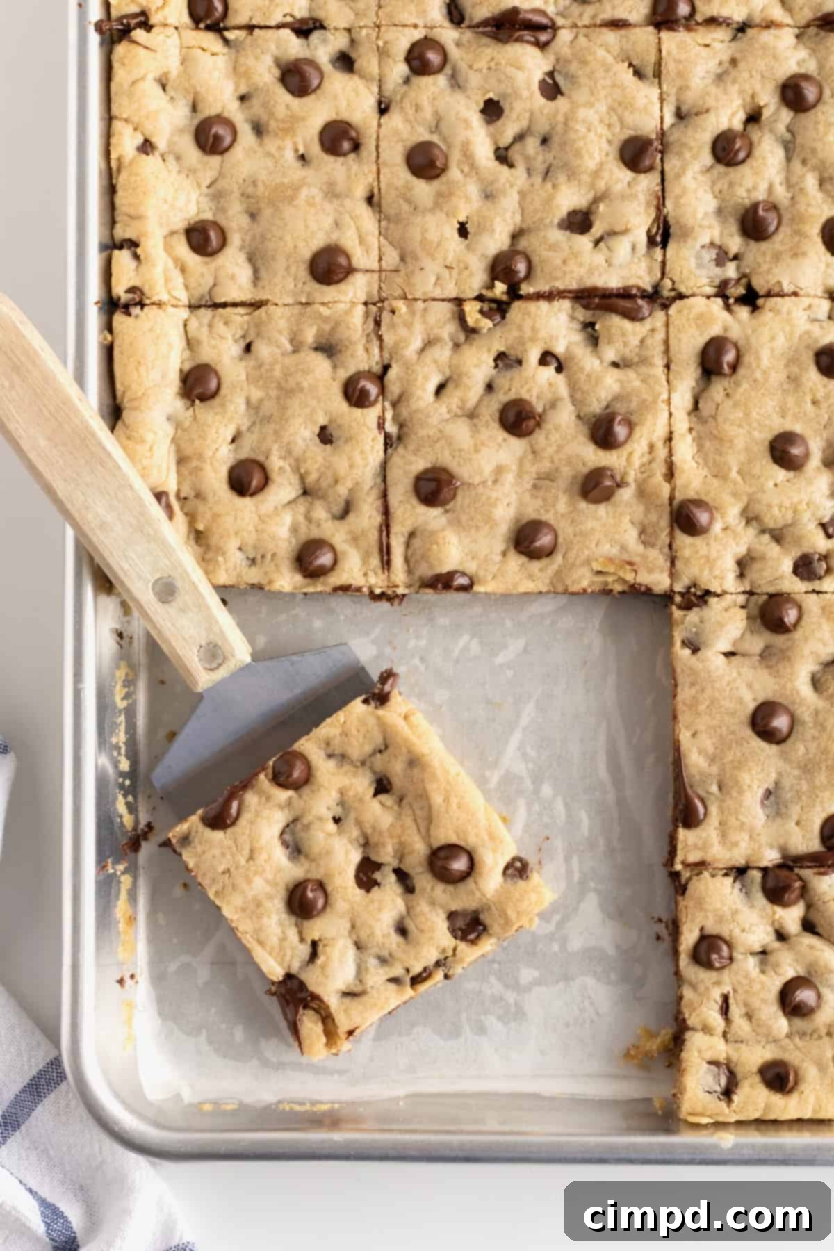 Sheet Pan Chocolate Chip Cookie Bars by The BakerMama