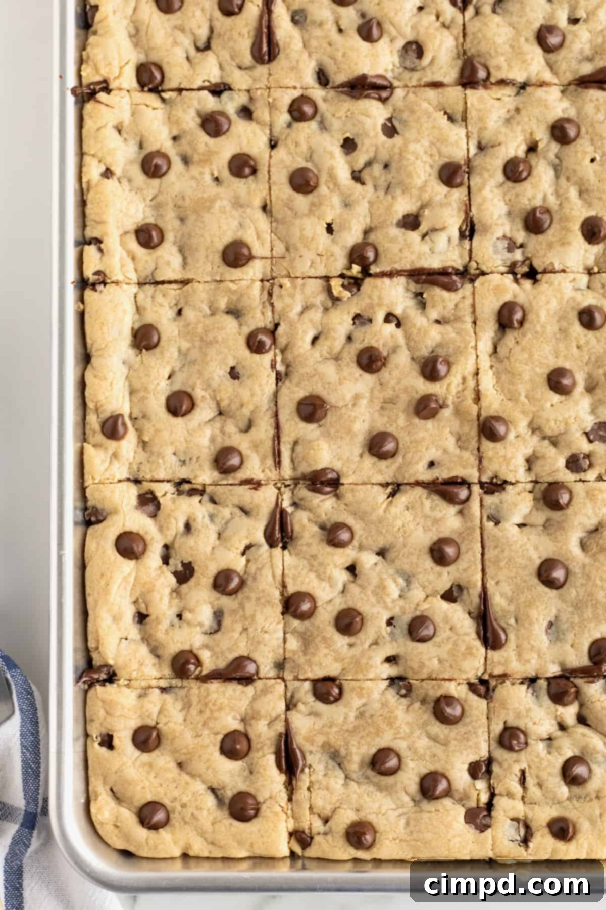 Sheet Pan Chocolate Chip Cookie Bars by The BakerMama