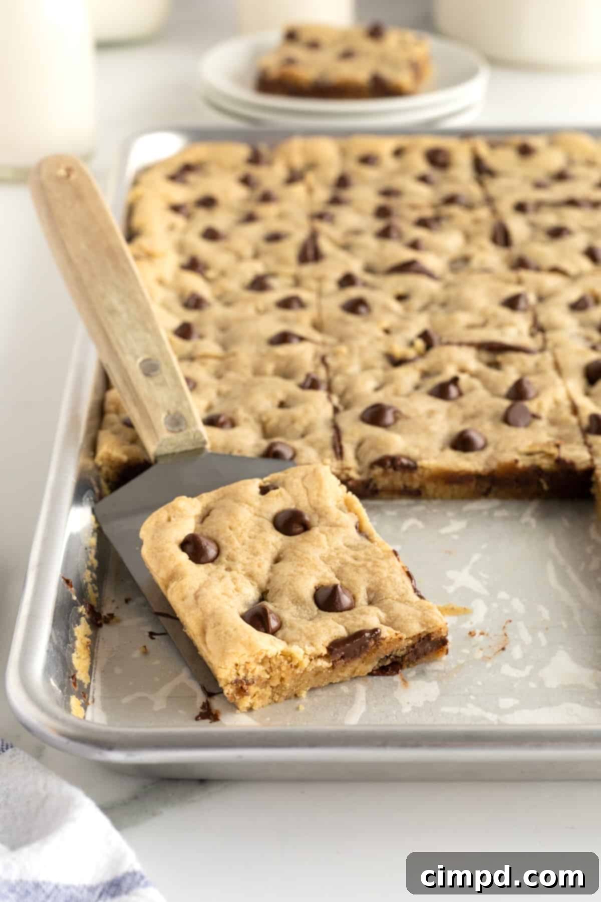 Sheet Pan Chocolate Chip Cookie Bars by The BakerMama