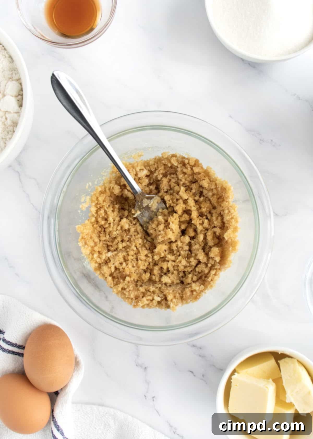 Streusel topping ingredients being combined in a bowl with a fork