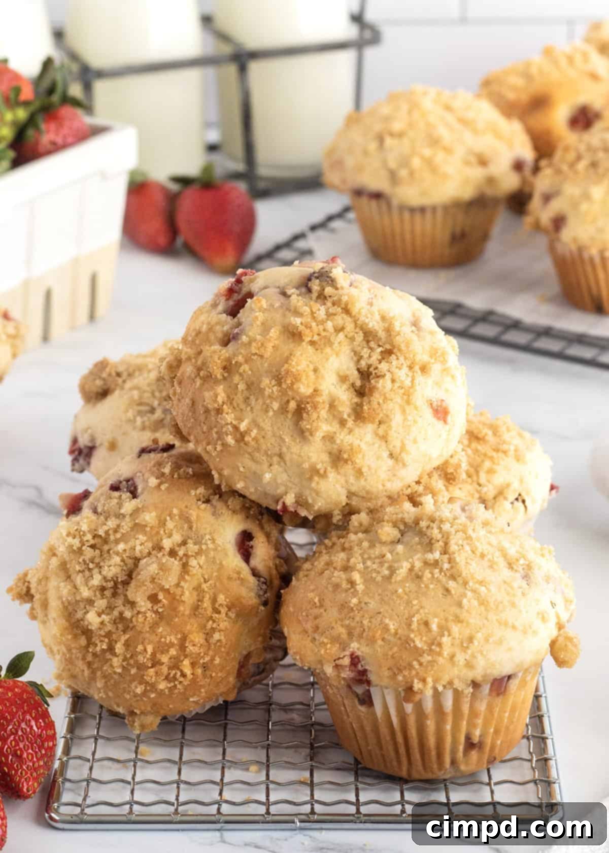 Freshly baked Strawberry Streusel Muffins cooling on a wire rack