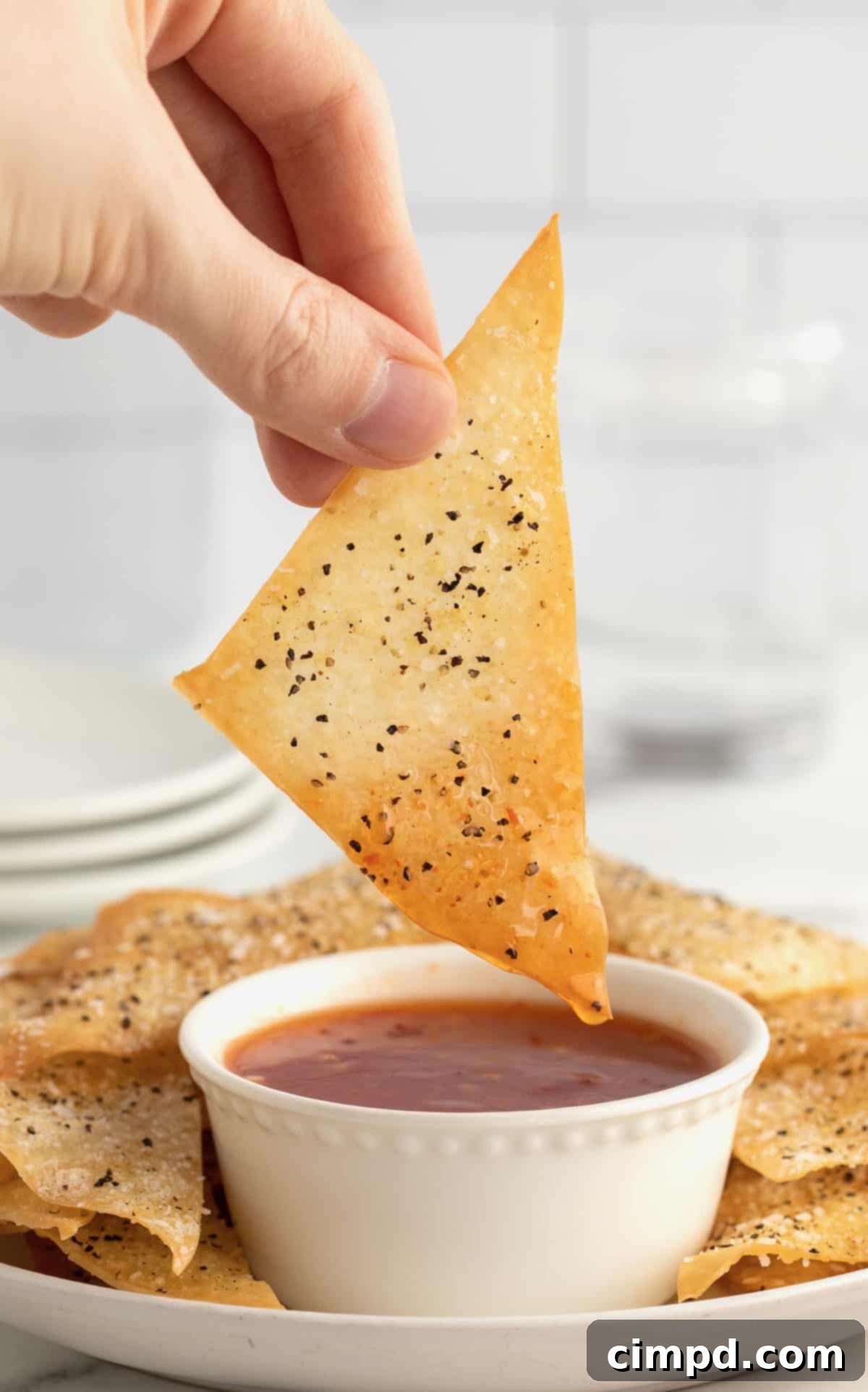 A stack of freshly baked wonton chips, ready to be served