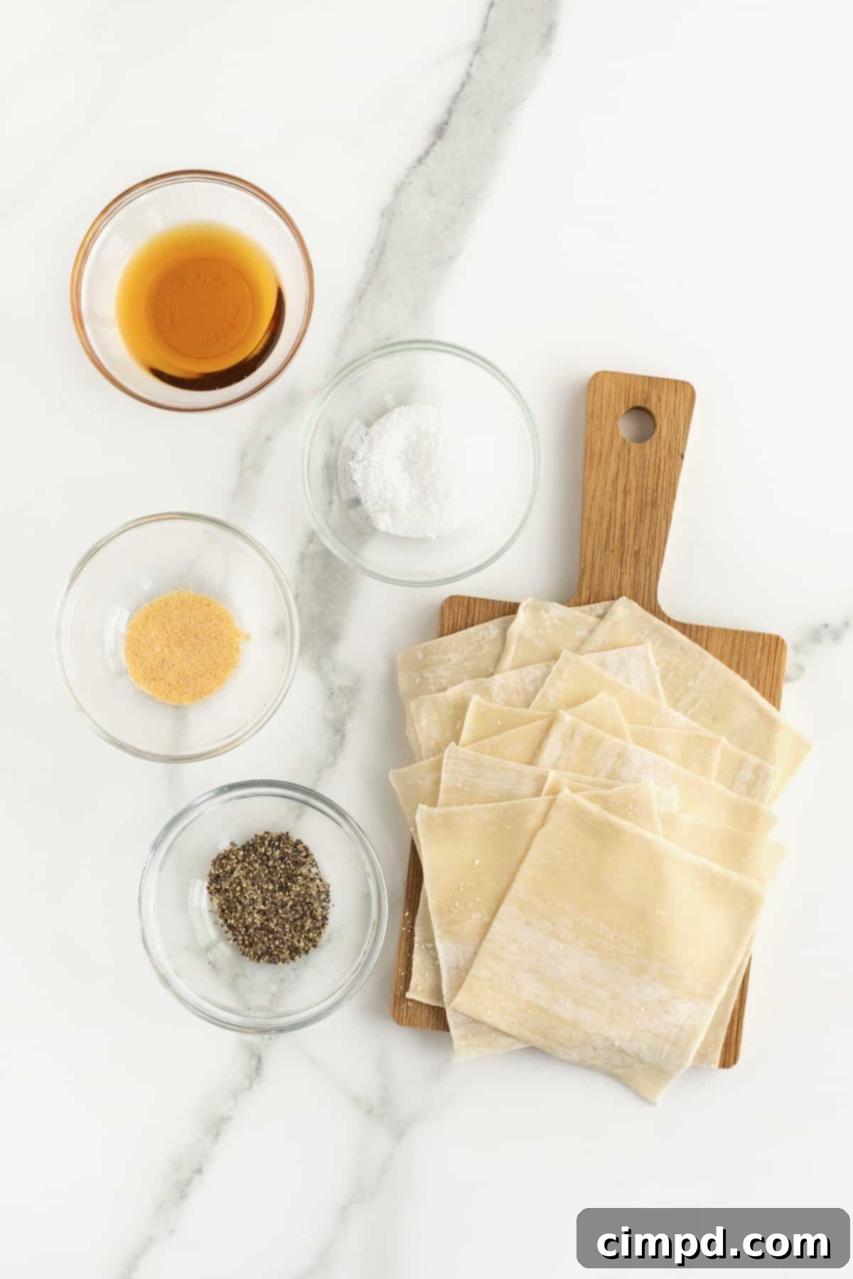 Ingredients for baked wonton chips laid out on a counter