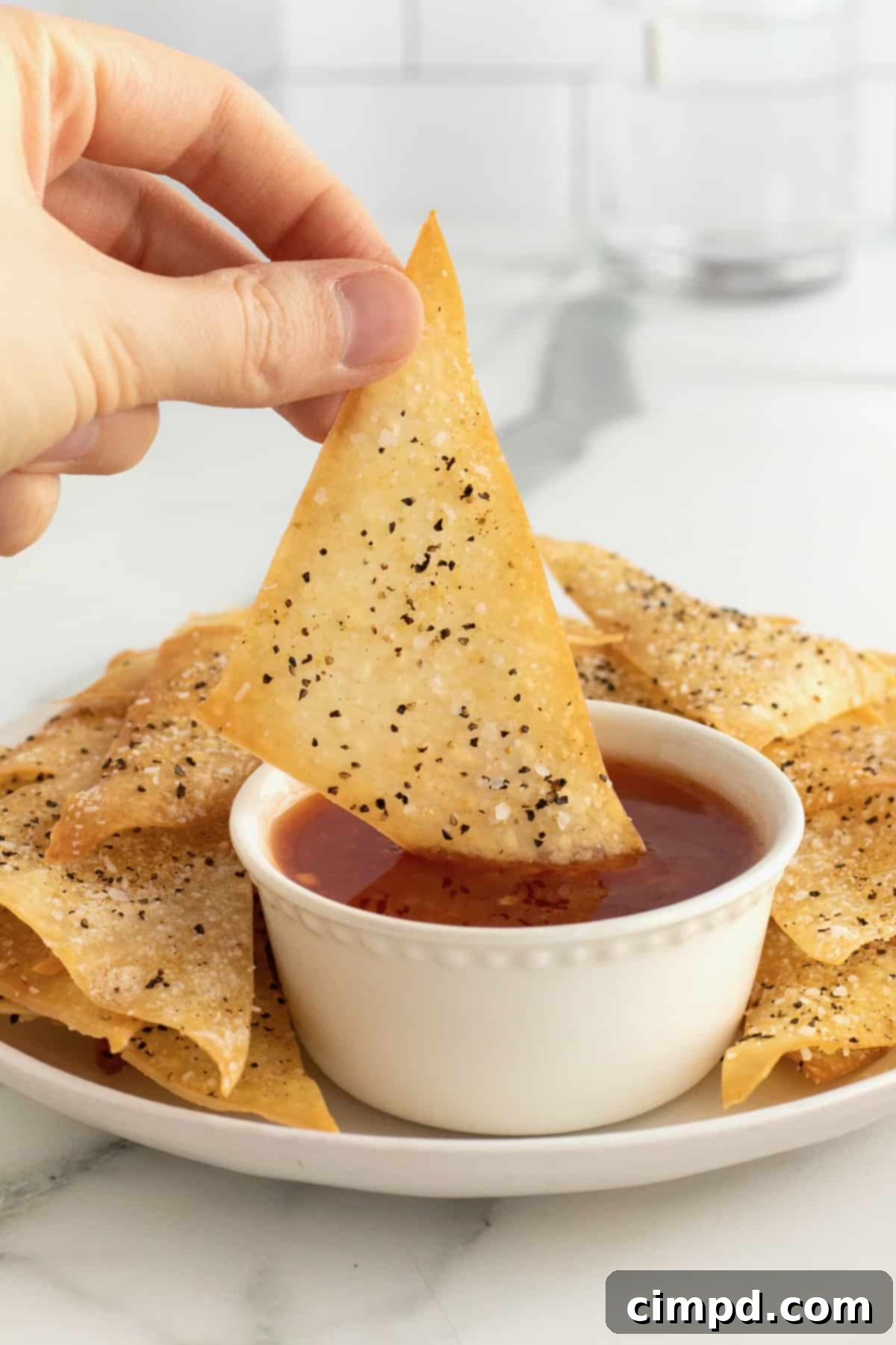 Step-by-step: finished baked wonton chips on a baking sheet
