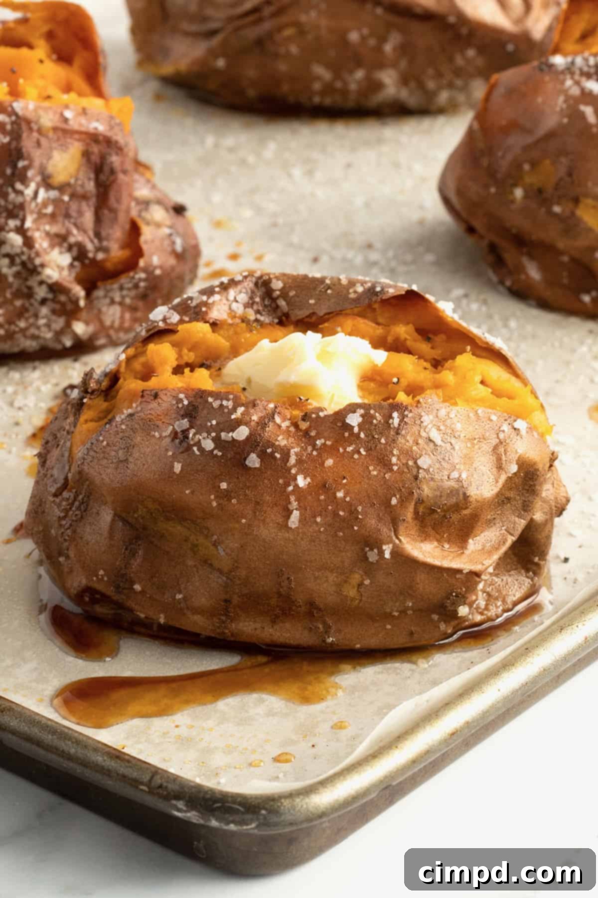 Perfect Baked Sweet Potatoes 2 How to Bake a Sweet Potato by The BakerMama - Golden brown baked sweet potato on a cooling rack.