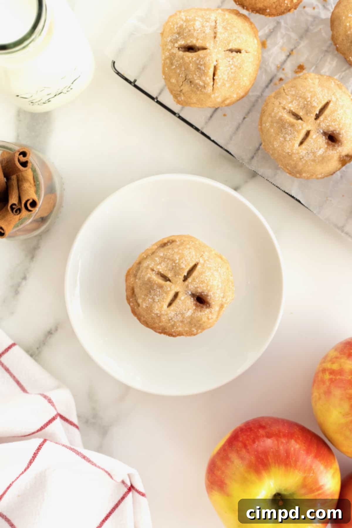 An Apple Pie Bite on a small white dessert plate.