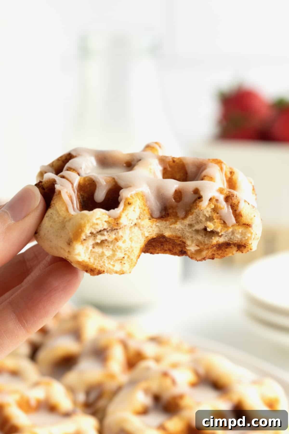 Cinnamon Roll Waffles with berries and powdered sugar