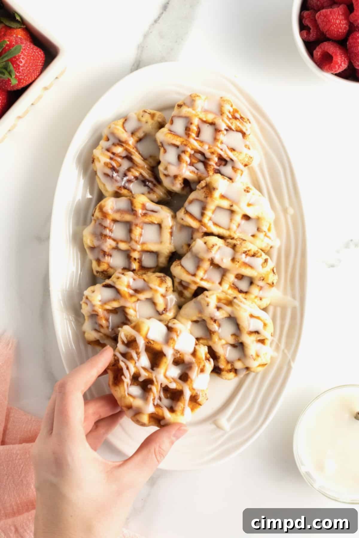 Close-up of fluffy Cinnamon Roll Waffles with icing