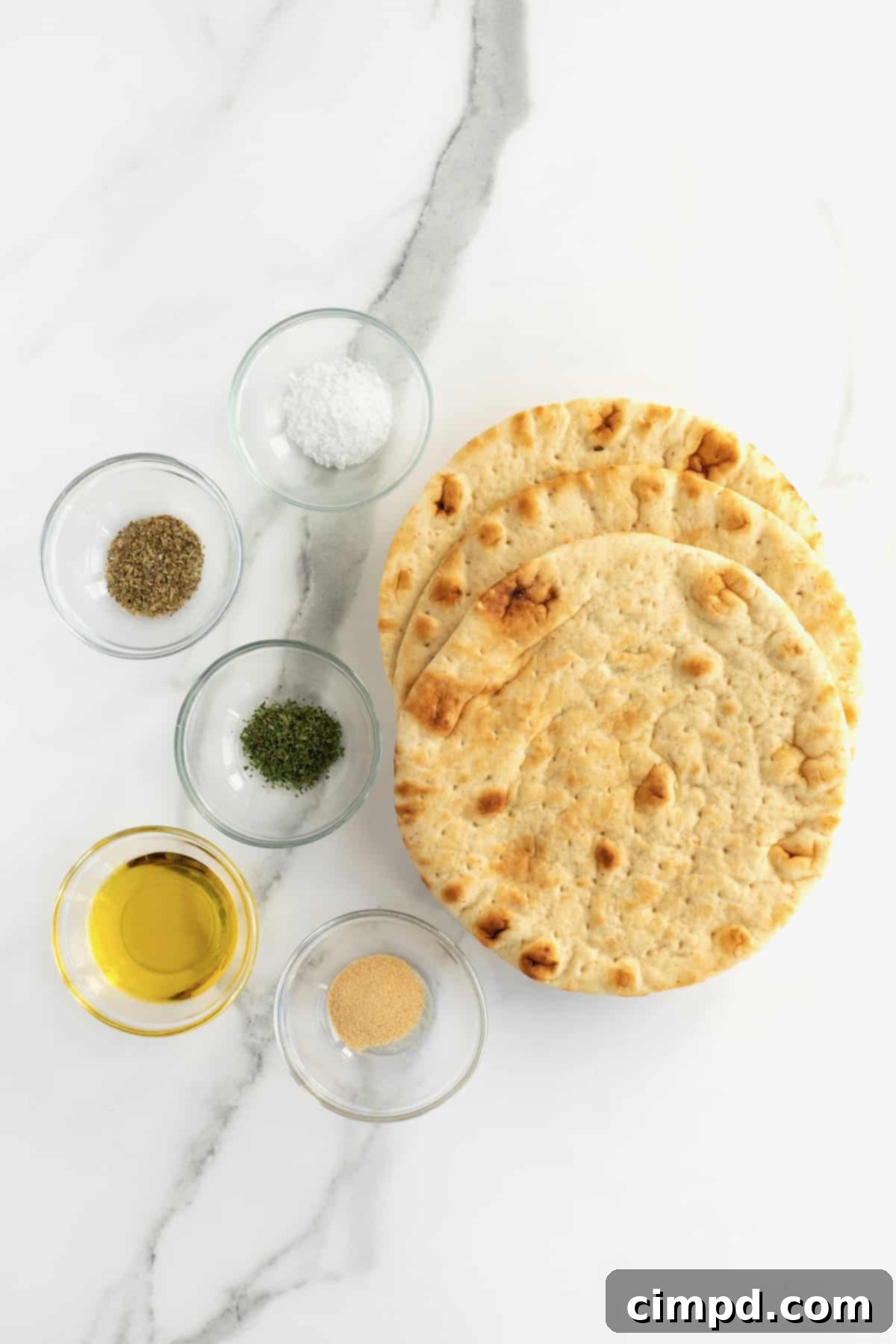 Ingredients for Baked Pita Chips laid out on a kitchen counter