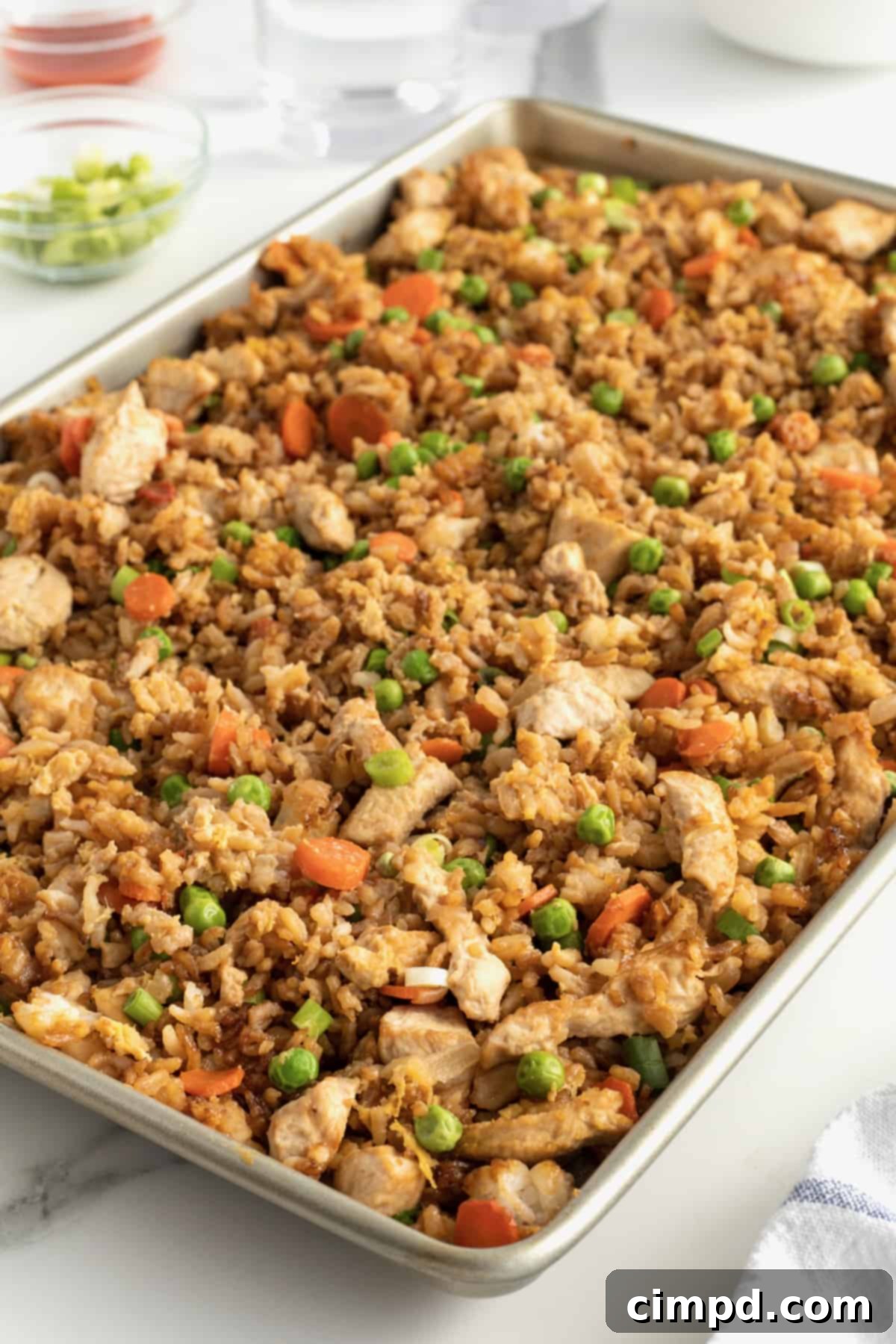 Ready-to-serve Sheet Pan Chicken Fried Rice with fresh garnishes