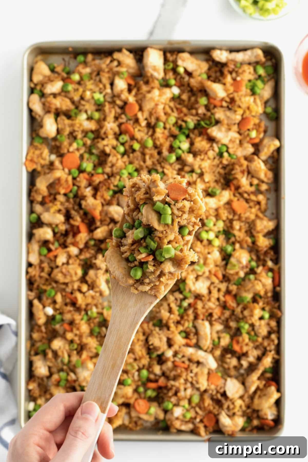 Overhead view of Sheet Pan Chicken Fried Rice, showcasing its vibrant colors and textures