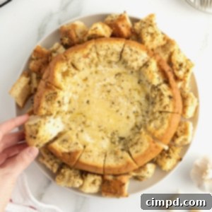 Garlic Butter Baked Brie in a Bread Bowl