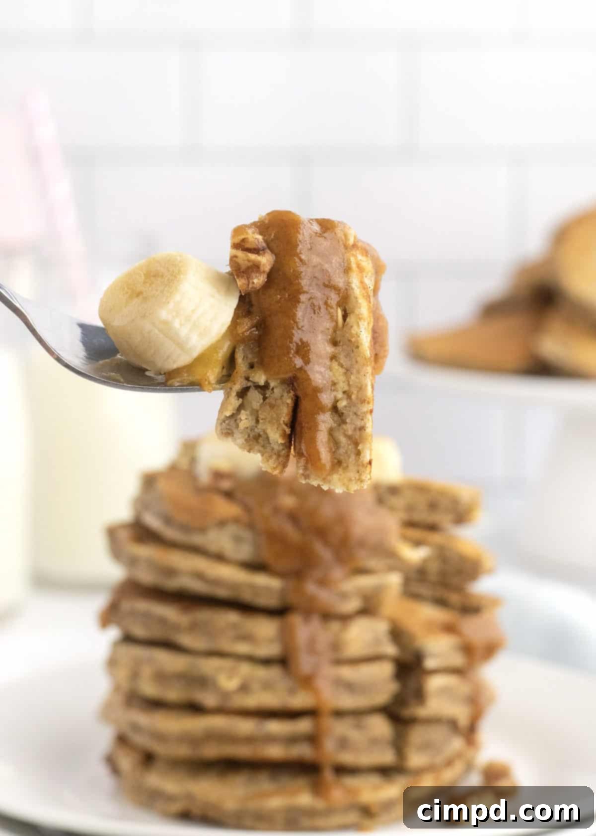 Wholesome Banana Nut Oat Pancakes 3 A stack of freshly made Whole Wheat Banana Nut Oat Pancakes, ready to be served