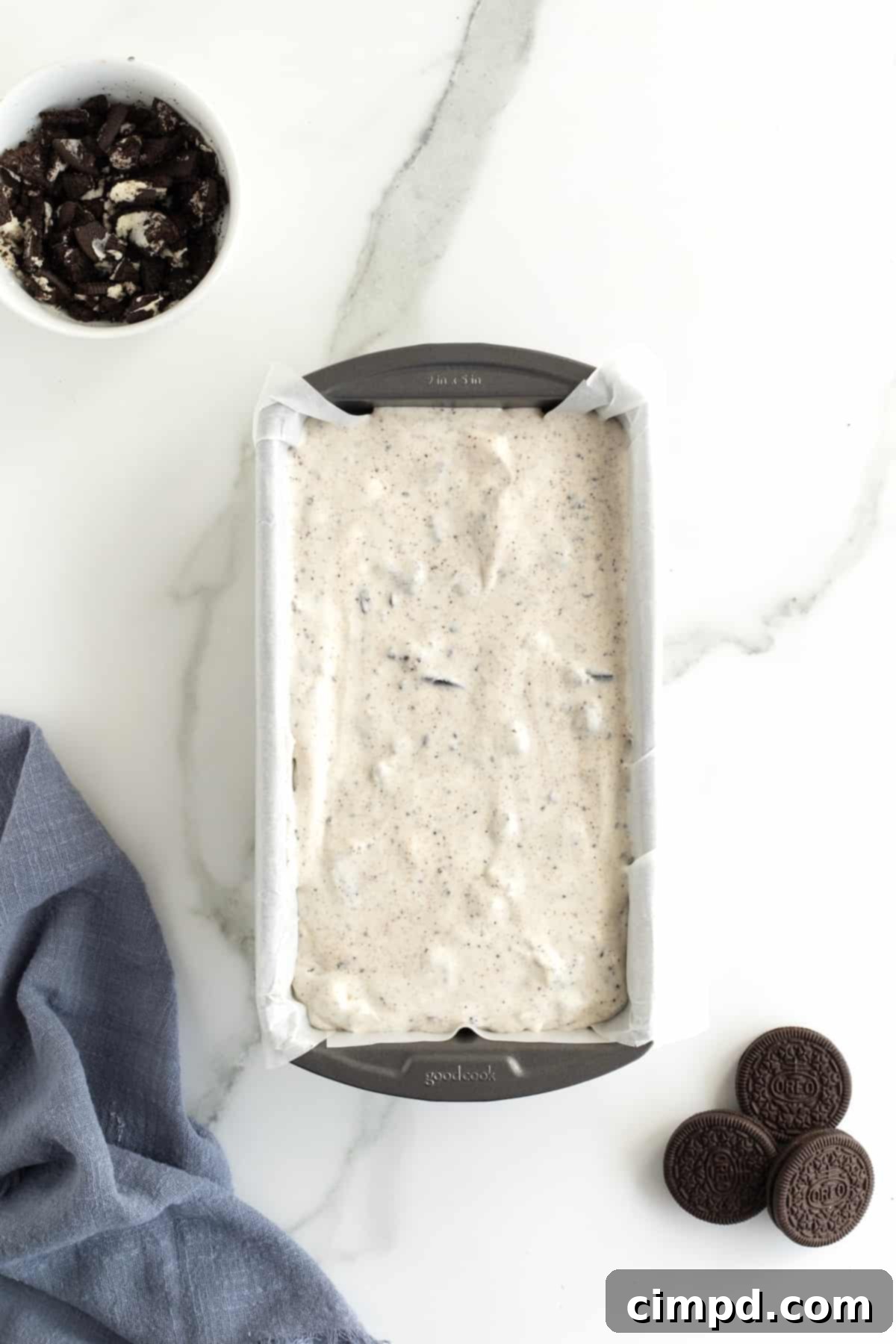Black and White Bliss 9 The smooth ice cream base carefully poured into the parchment-lined loaf pan, filling it perfectly before the final touches.