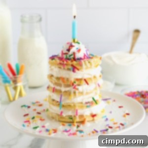 Celebration Pancake Stack 11 Five homemade pancakes with whipped topping between to make a layer cake, topped with whipped topping, sprinkles and a single candle.