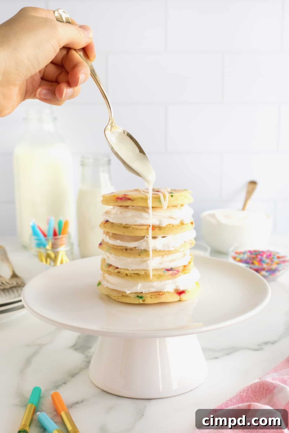 Celebration Pancake Stack 7 A layer cake made from confetti pancakes drizzled with simple icing.