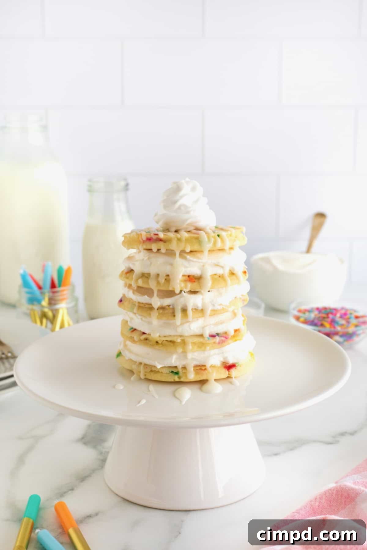 Celebration Pancake Stack 8 A layer cake made from confetti pancakes topped with whipped topping.