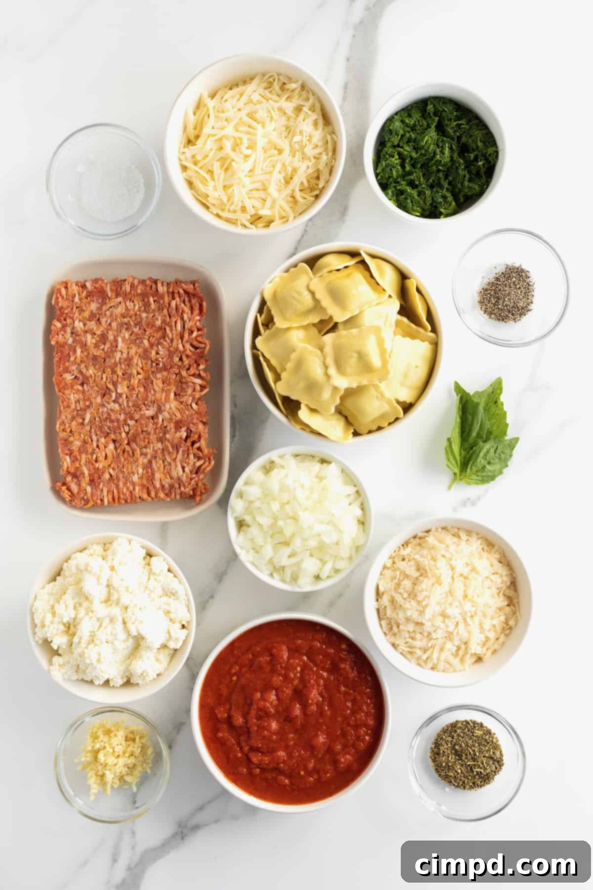 Store bough ravioli, ground Italian sausage, chopped onion, ricotta cheese, shredded mozzarella cheese, grated parmesan cheese, fresh basil, marinara sauce and black pepper in glass dishes.