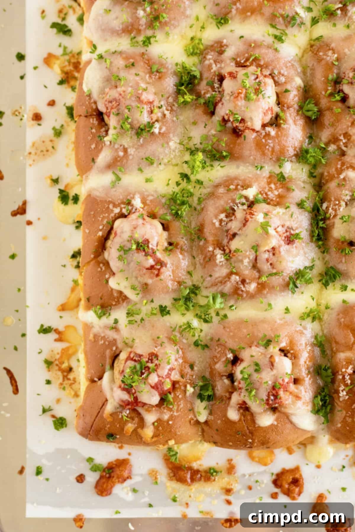A freshly baked tray of Meatball Stuffed Garlic Rolls, ready for serving or to be stored for later enjoyment.