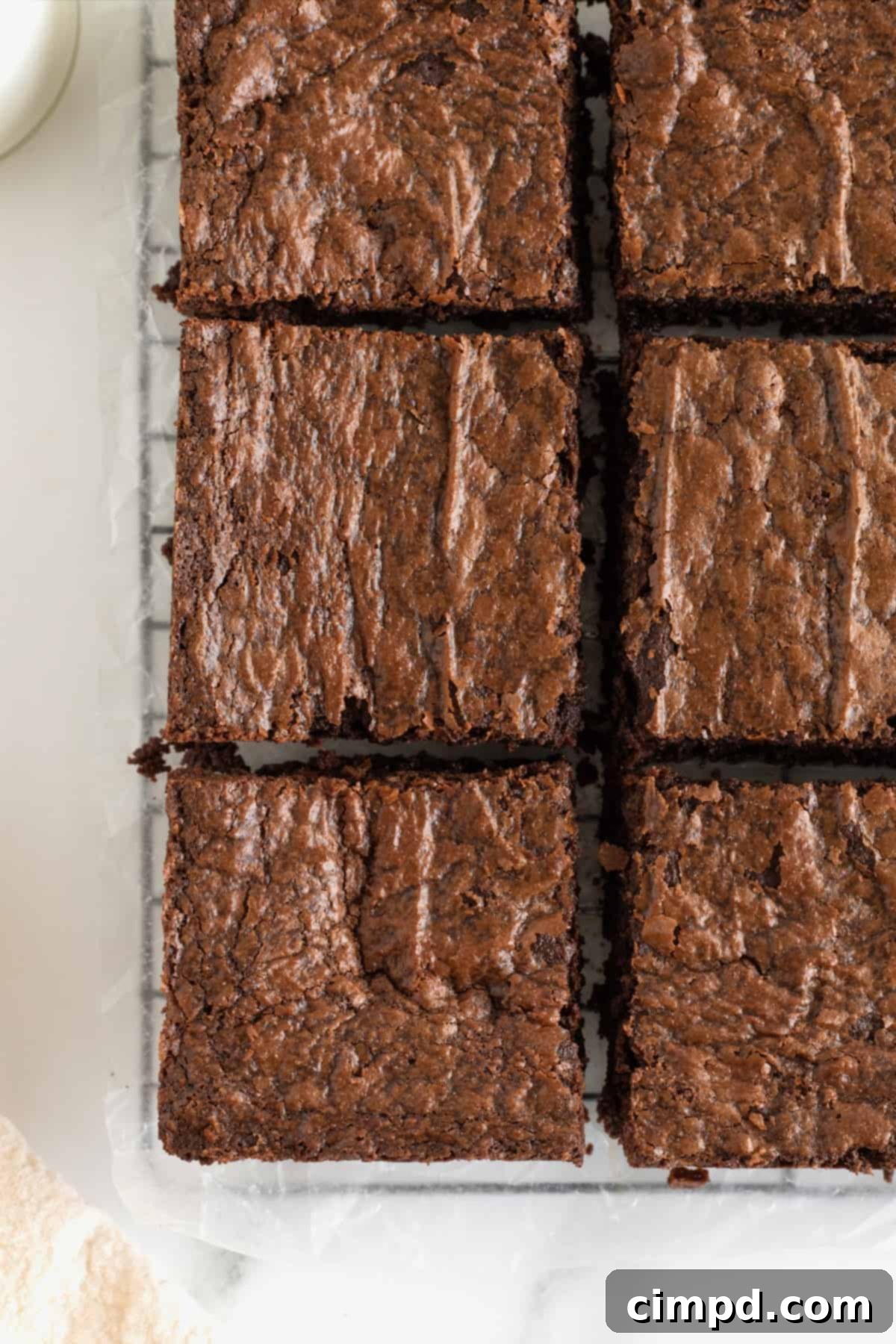 Brownies with a crackly top cut into squares.