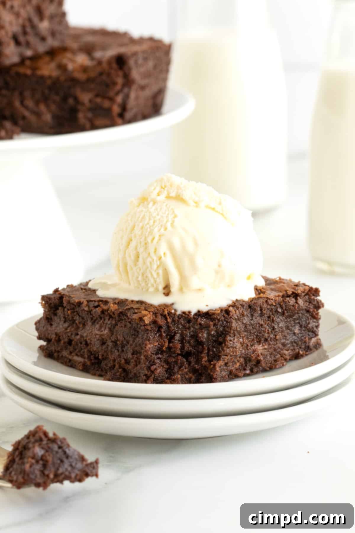 A Nutella brownie sundae with a scoop of vanilla ice cream on top.