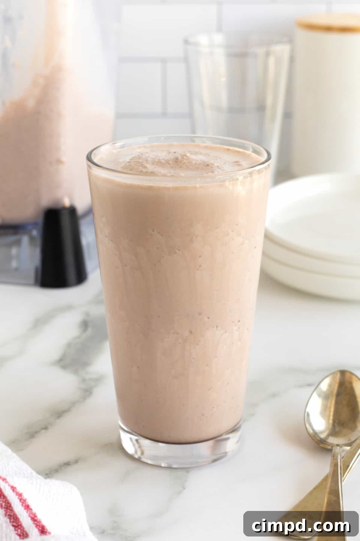 A clear glass filled with an homemade Wendy's frosty, perfect for a refreshing treat.