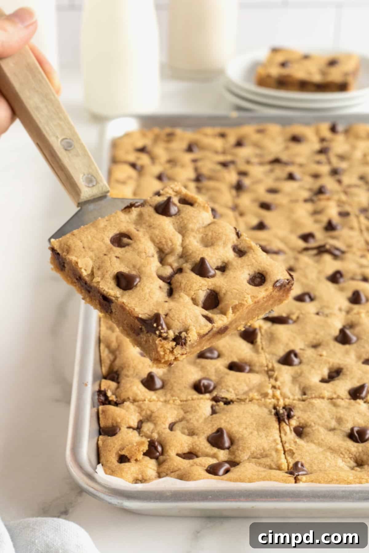 A sheet pan of peanut butter chocolate chip cookie bars.