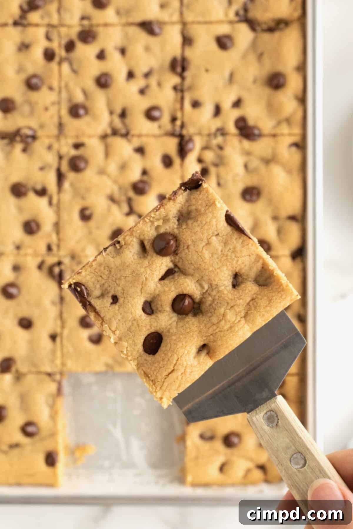 A sheet pan of peanut butter chocolate chip cookie bars.