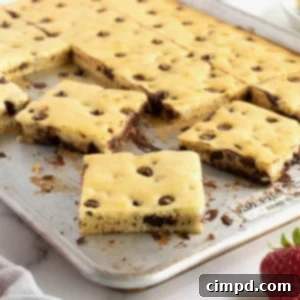 An aluminum sheet pan with square cut chocolate chip pancakes.